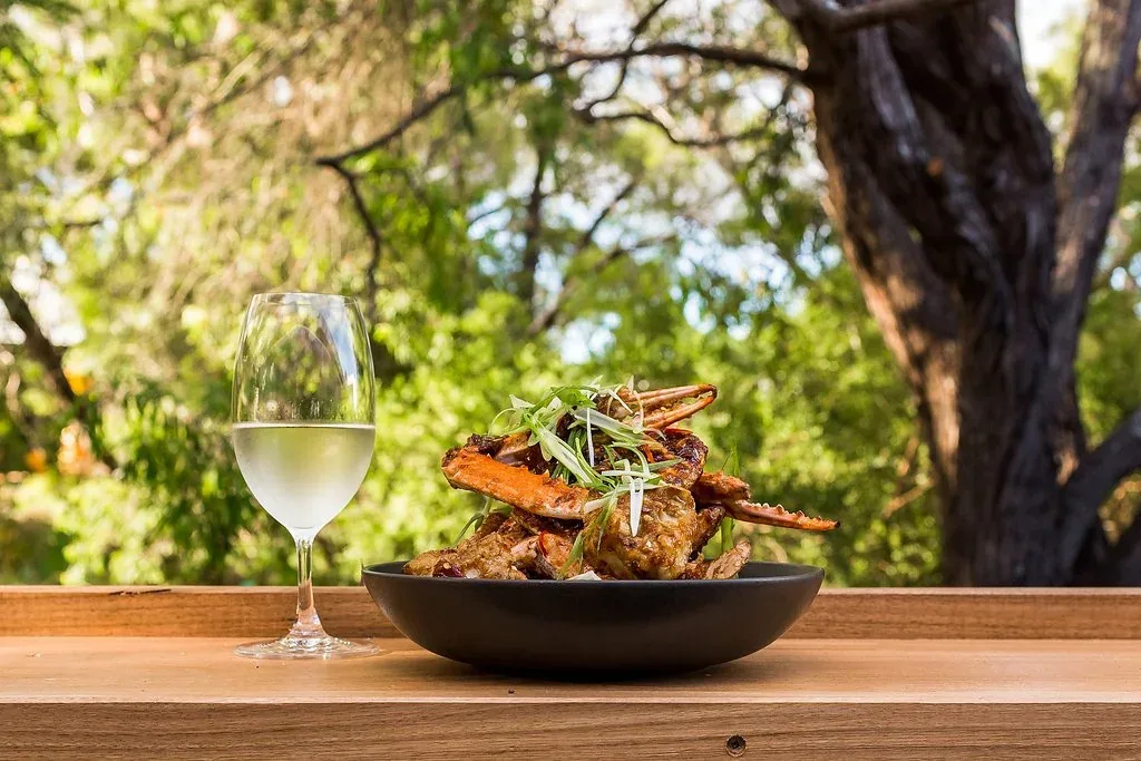 Al fresco dining under the trees at Blue Manna Bistro